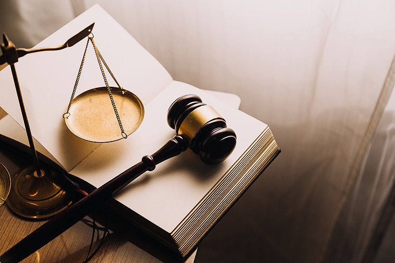 Justice and law concept.Male judge in a courtroom with the gavel