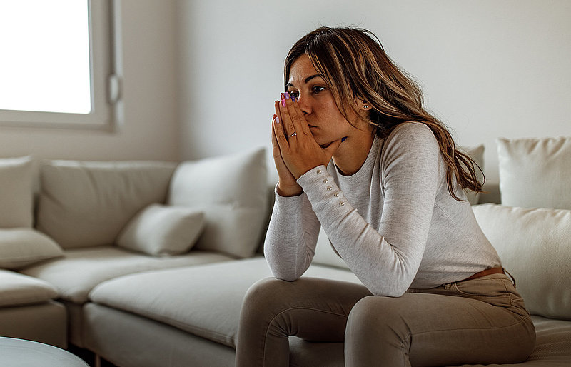 Having negative vibes, looking stressed.