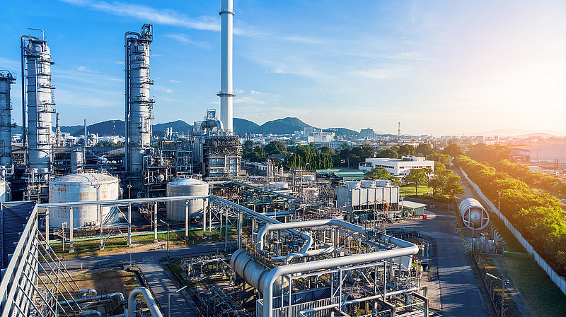 Aerial view of smart chemical oil refinery plant, power plant on blue sky background , Gas Oil depot, Crude Oil Refinery Plant Steel Pipe line and Chimney Cooling tower, Chemical or Petrochemical