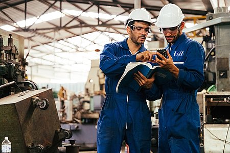 Group of industrial factory maintenance engineers inspect relay