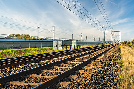 Rail tracks on concrete sleepers and basalt gravel in the Netherlands