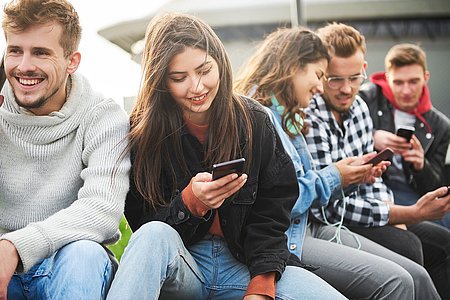 Close of a young people who use mobile phone